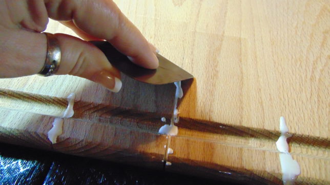 Forcing glue into crack of cutting board