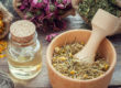 Herbs in wooden mortar with pestle