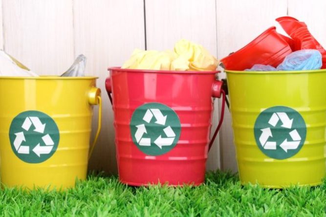 Three colorful plastic Recycle bins