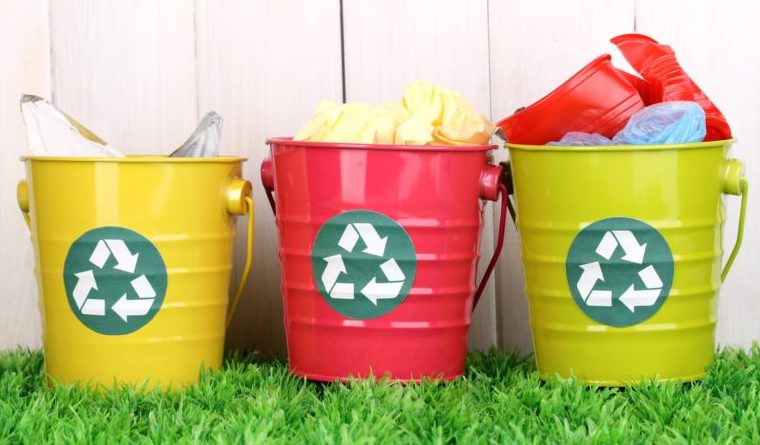 Three colorful plastic Recycle bins